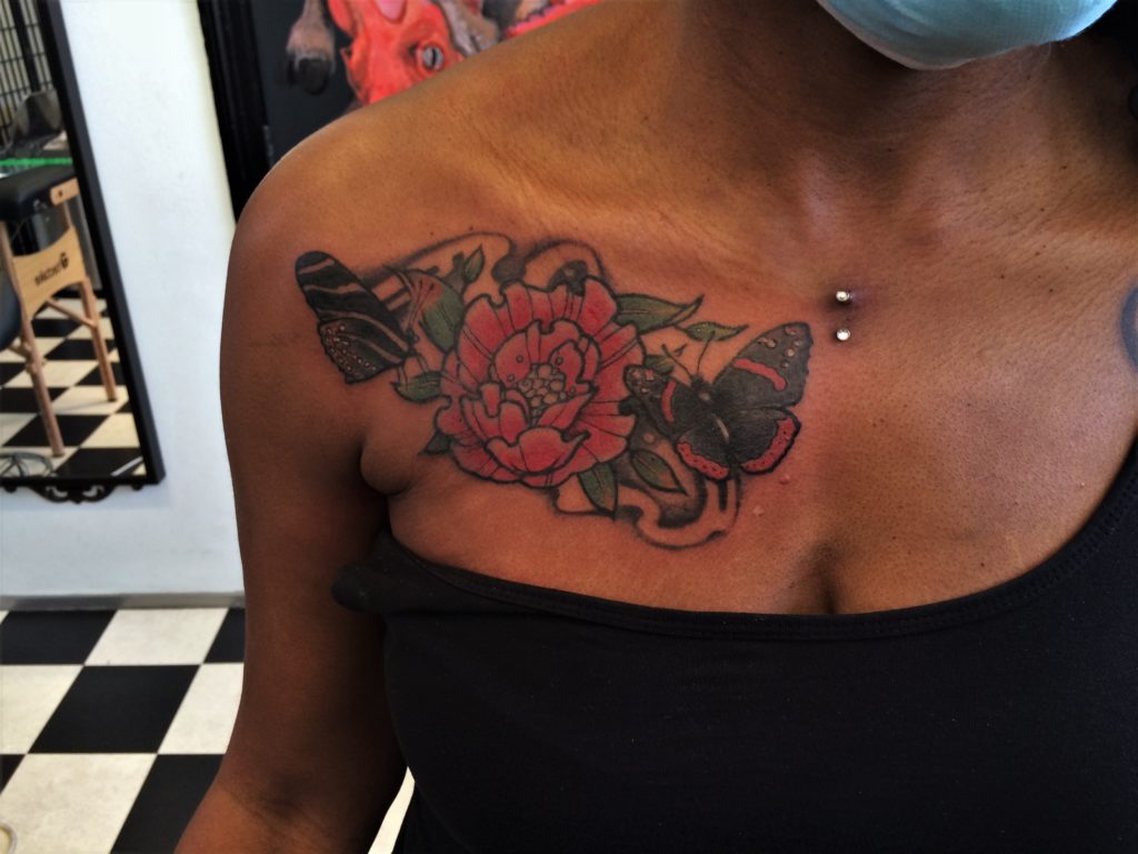 flower and butterfly tattoo, dark skin