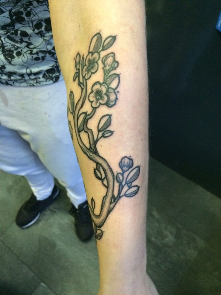 Bold cherryblossom cartoon tattoo by our studio.