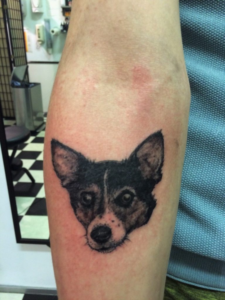 realistic dog portrait tattoo done at our shop..