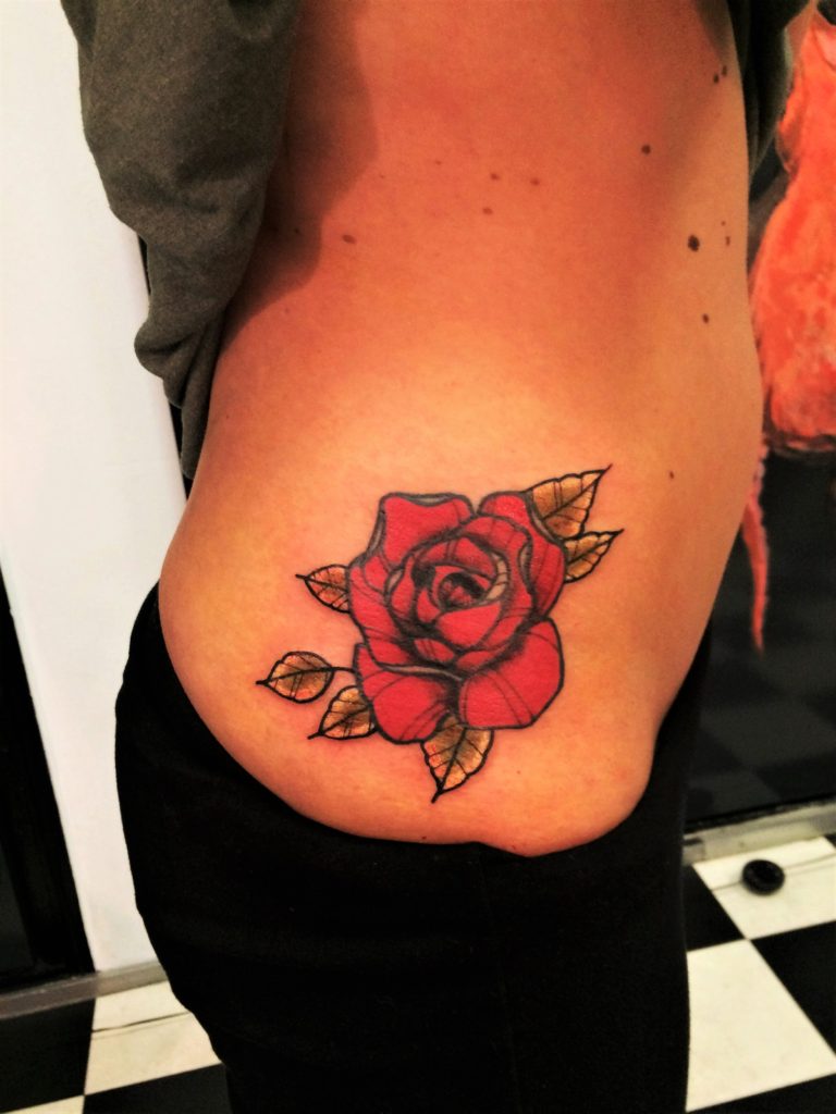 cartoon red rose leg tattoo.