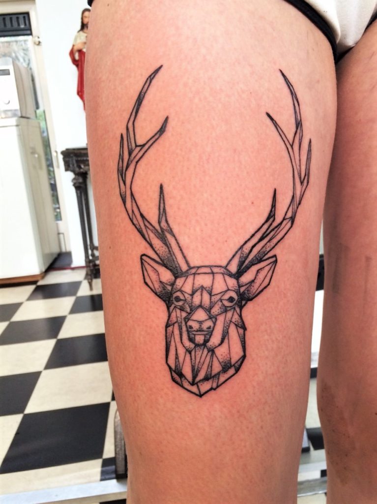 geometric deer leg tattoo from our tattoostudio in Rotterdam.