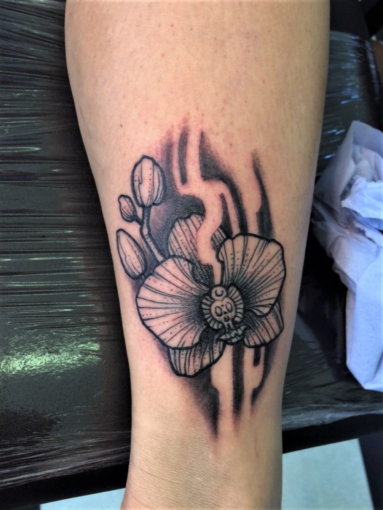 orchid flower tattoo black dotwork in our tattoogallery