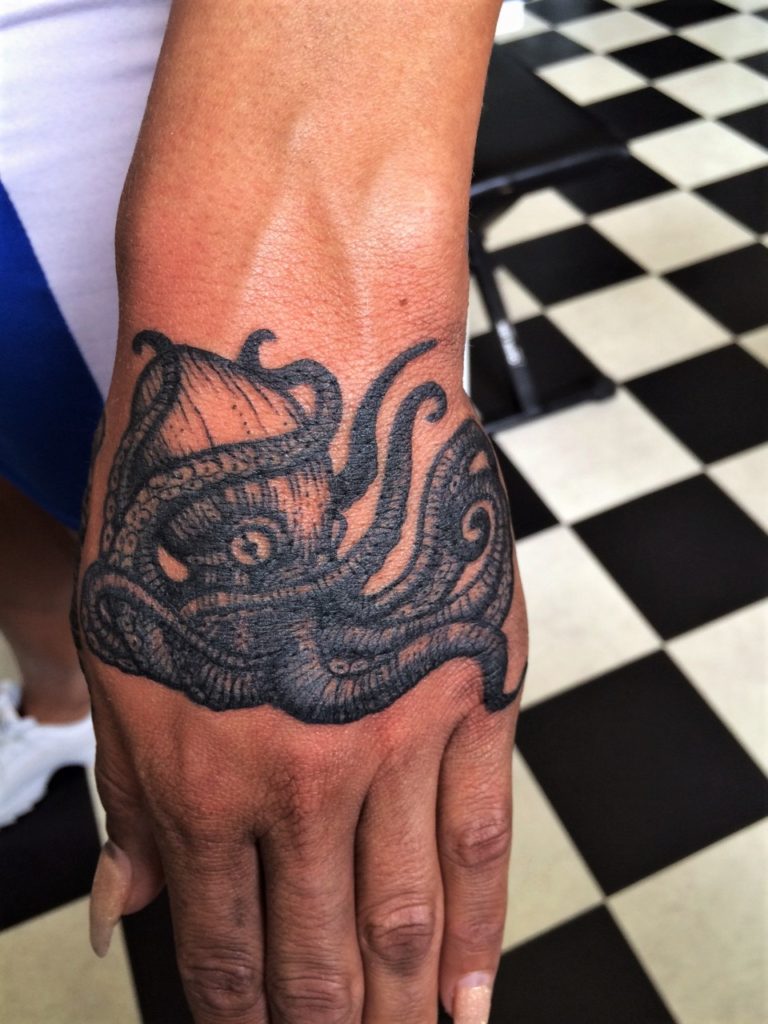 octopus or kraken tattoo hand piece