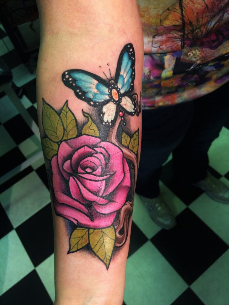newschool full colour custom rose arm tattoo from our tattooshop in Rotterdam.